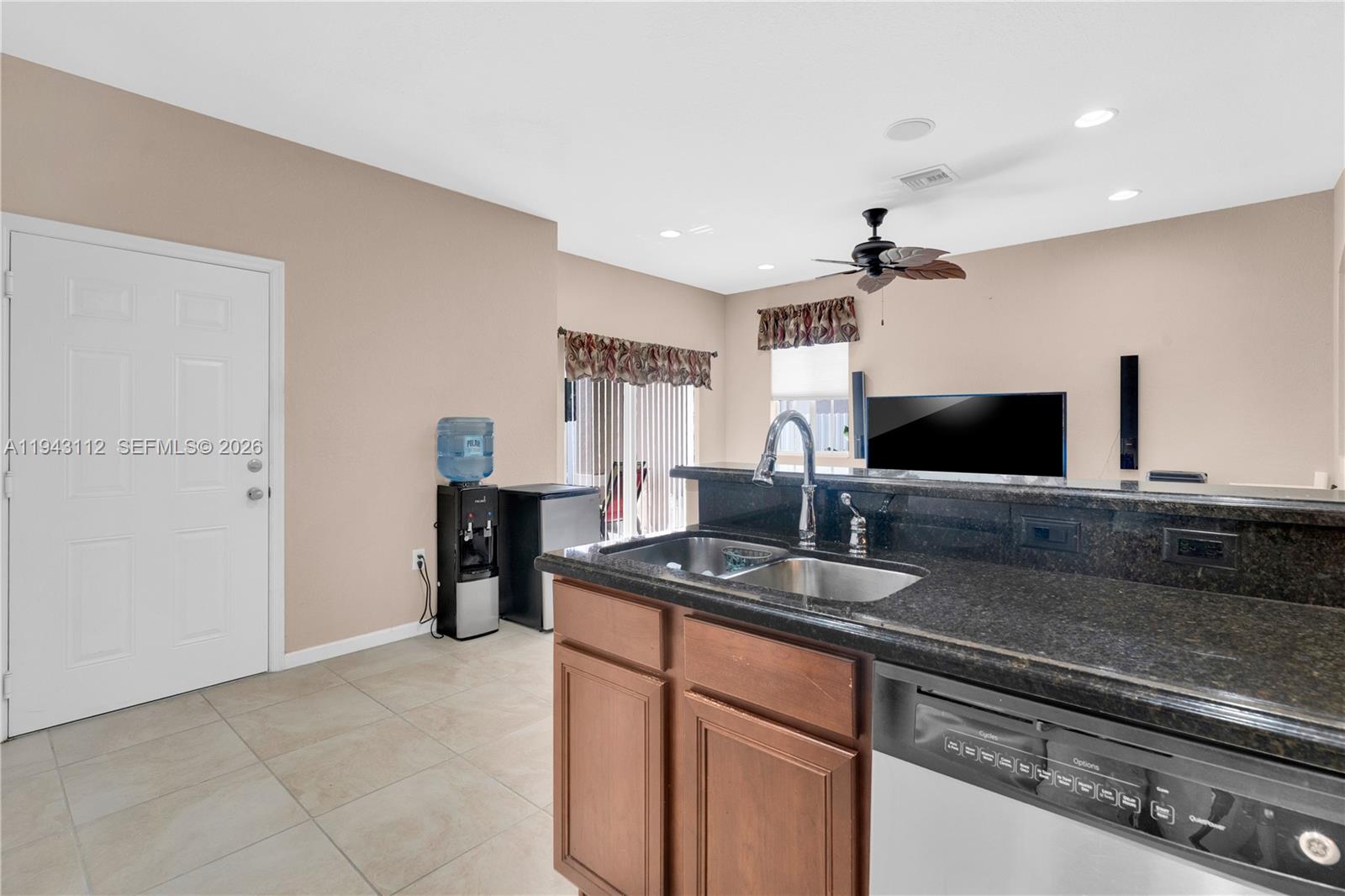 14102 Southwest 276th Street Homestead, FL 33032 - Photo 16 of 36 a kitchen with stainless steel appliances granite countertop a sink and a granite counter tops