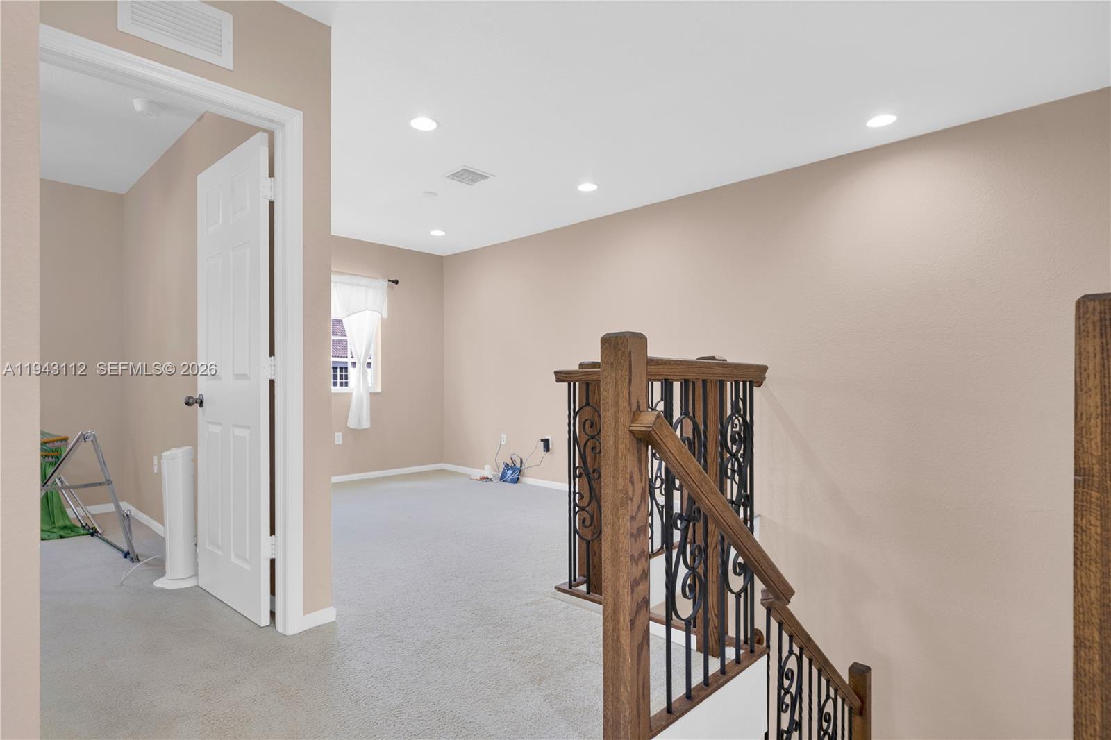 14102 Southwest 276th Street Homestead, FL 33032 - Photo 18 of 36 a view of a hallway with staircase