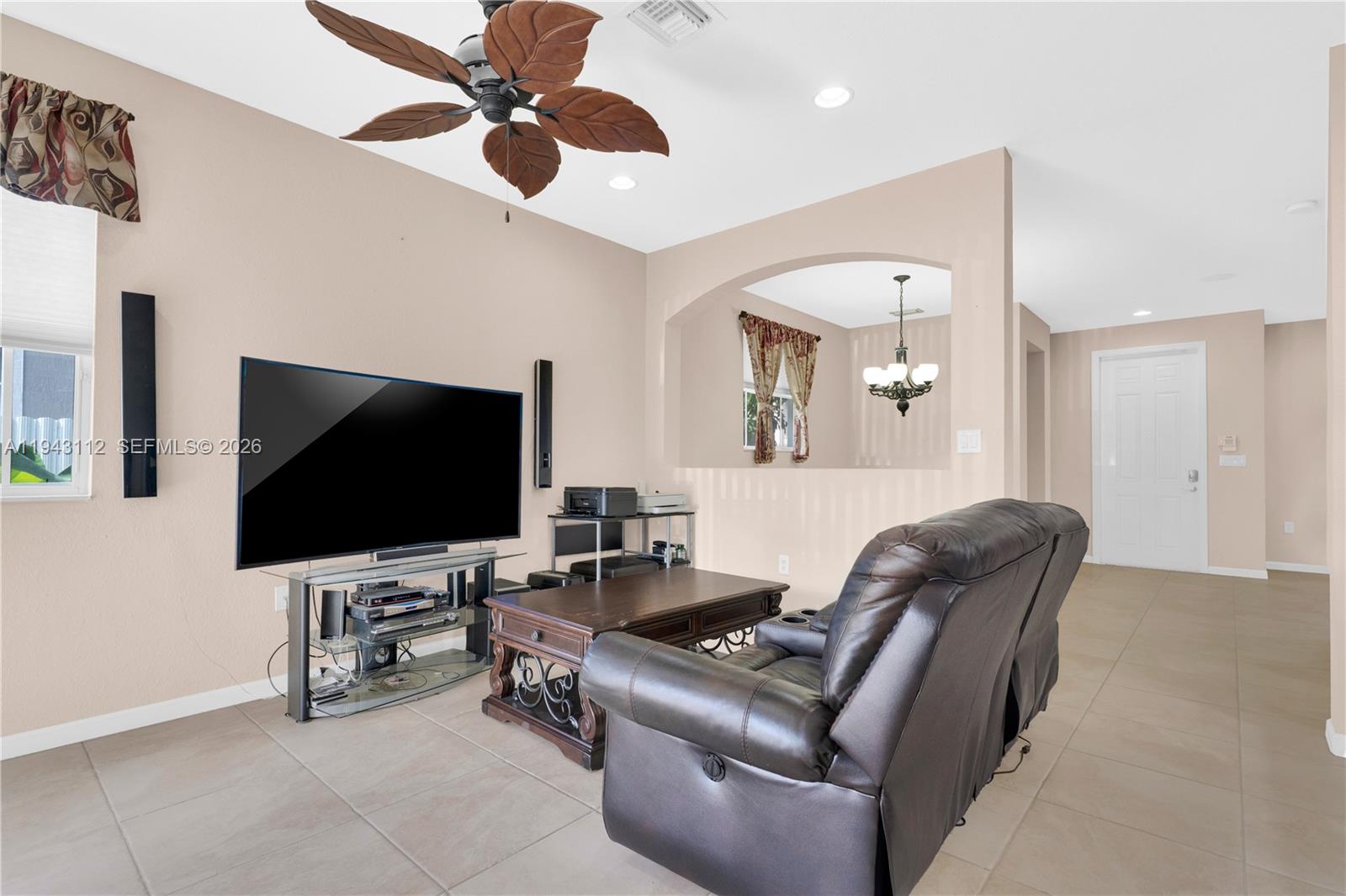 14102 Southwest 276th Street Homestead, FL 33032 - Photo 9 of 36 a living room with furniture and a flat screen tv
