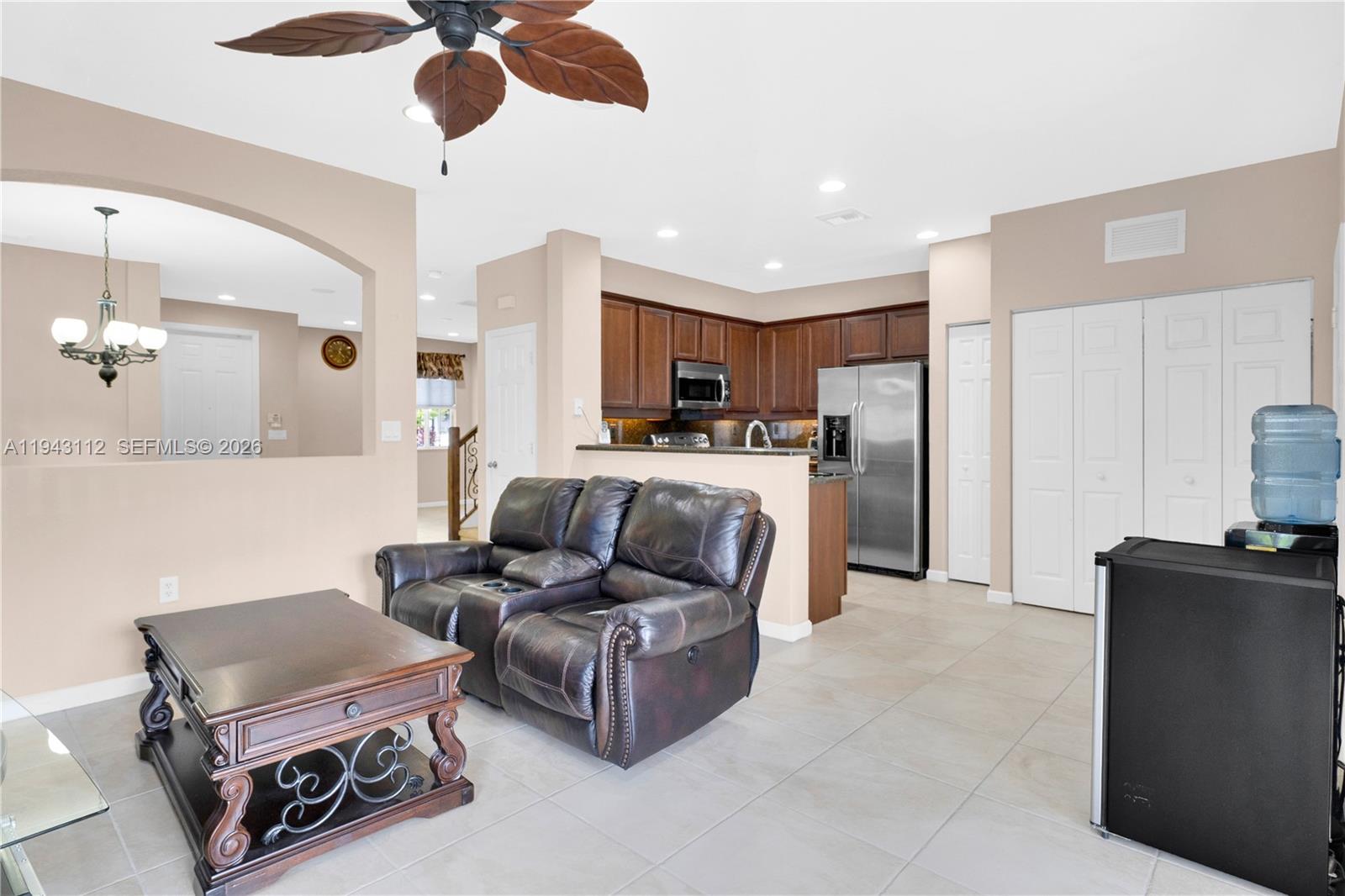 14102 Southwest 276th Street Homestead, FL 33032 - Photo 10 of 36 a living room with furniture and a flat screen tv