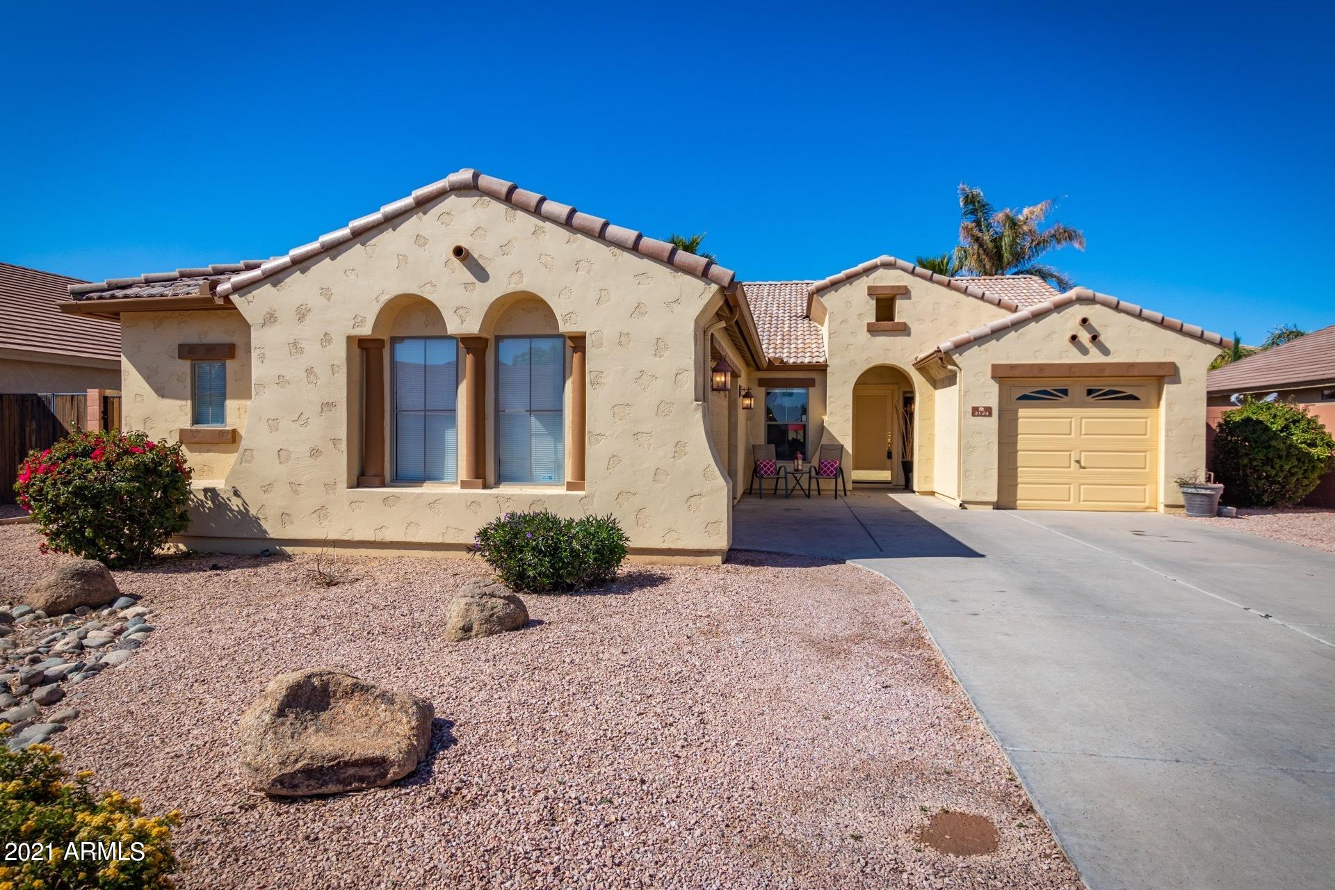 3124 South Martingale Road Gilbert, AZ 85295 - Photo 1 of 26 a view of a white house with a yard
