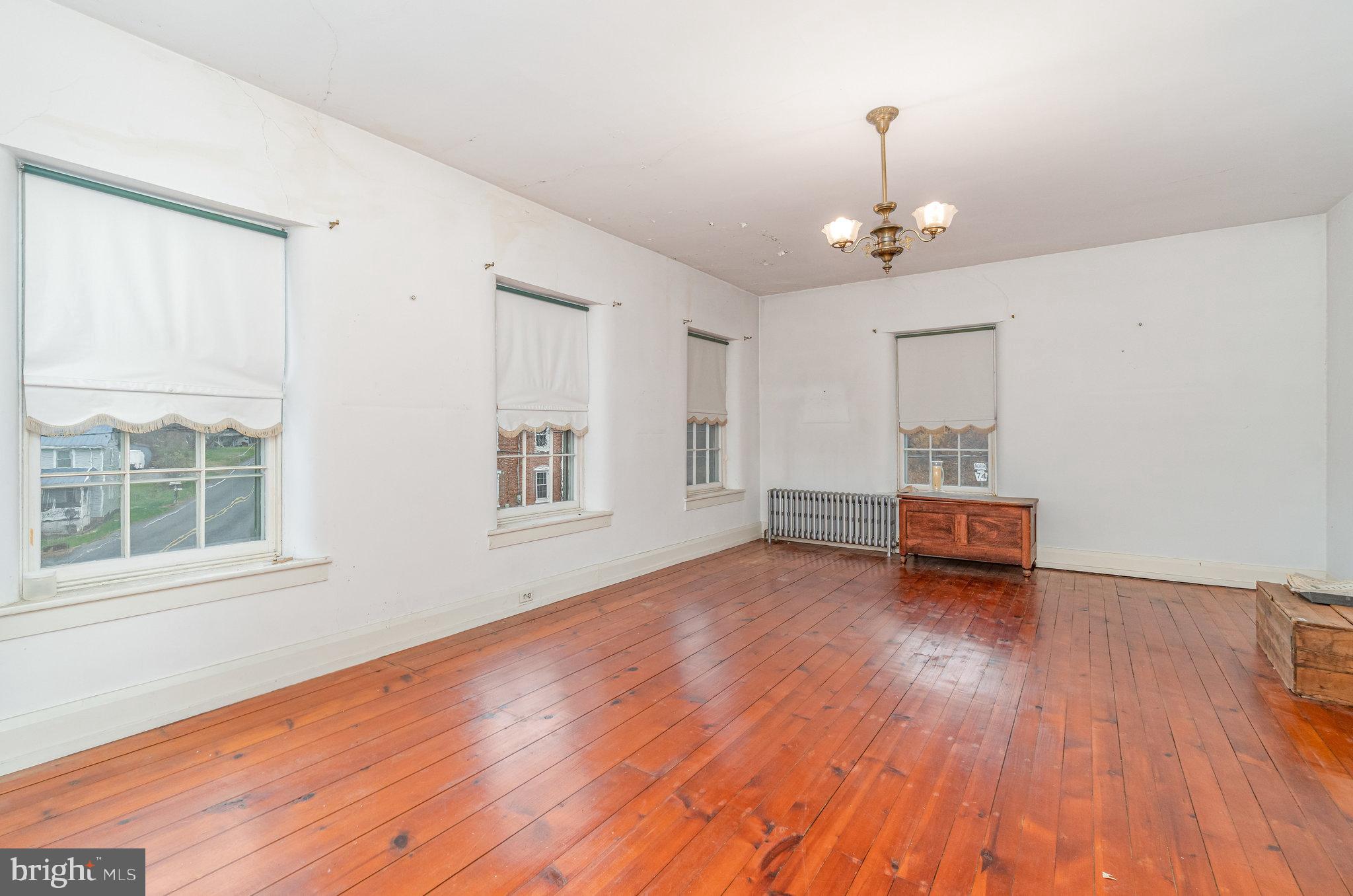 5575 Waggoners Gap Road Landisburg, PA 17040 - Photo 17 of 42 a view of empty room with wooden floor and window