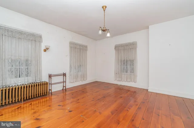 a view of empty room with stairs