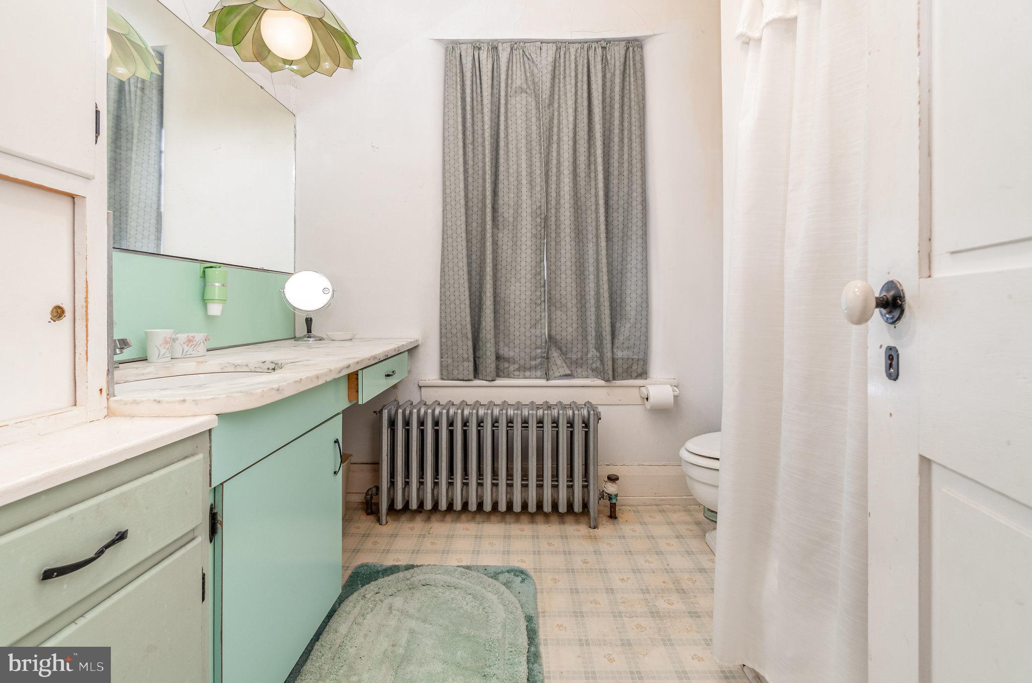 5575 Waggoners Gap Road Landisburg, PA 17040 - Photo 26 of 42 a bathroom with a sink a toilet and a mirror