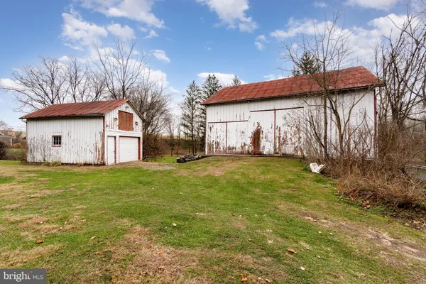 a view of a big yard with a house