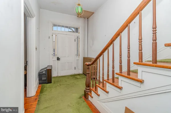 a view of an entryway with staircase