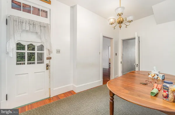 a dining room with a table and chairs