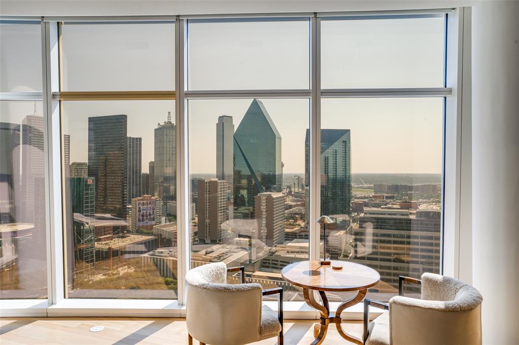 a dining room with furniture and a window