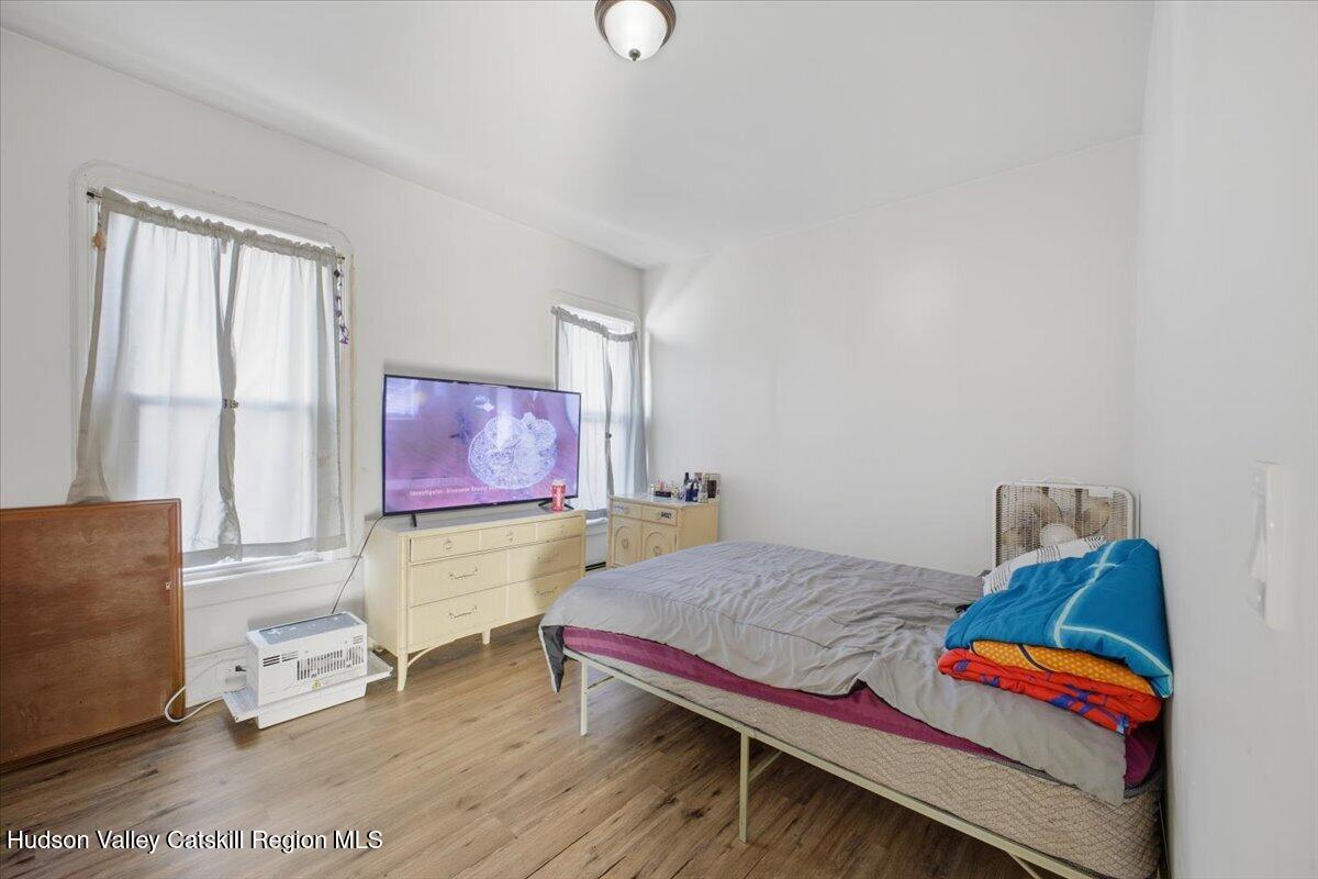 97 Maple Avenue Catskill, NY 12414 - Photo 22 of 27 a bedroom with furniture and a window