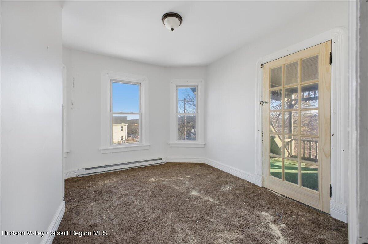 97 Maple Avenue Catskill, NY 12414 - Photo 9 of 27 an empty room with windows
