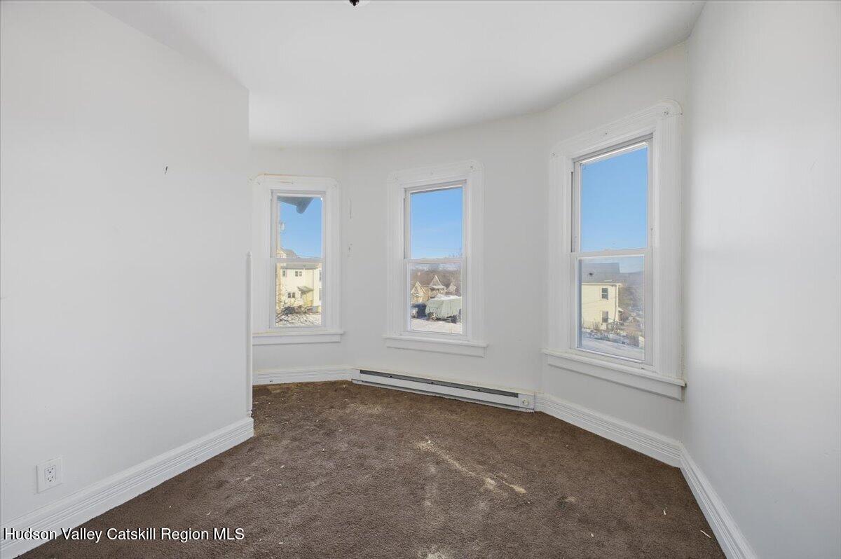 97 Maple Avenue Catskill, NY 12414 - Photo 10 of 27 an empty room with windows