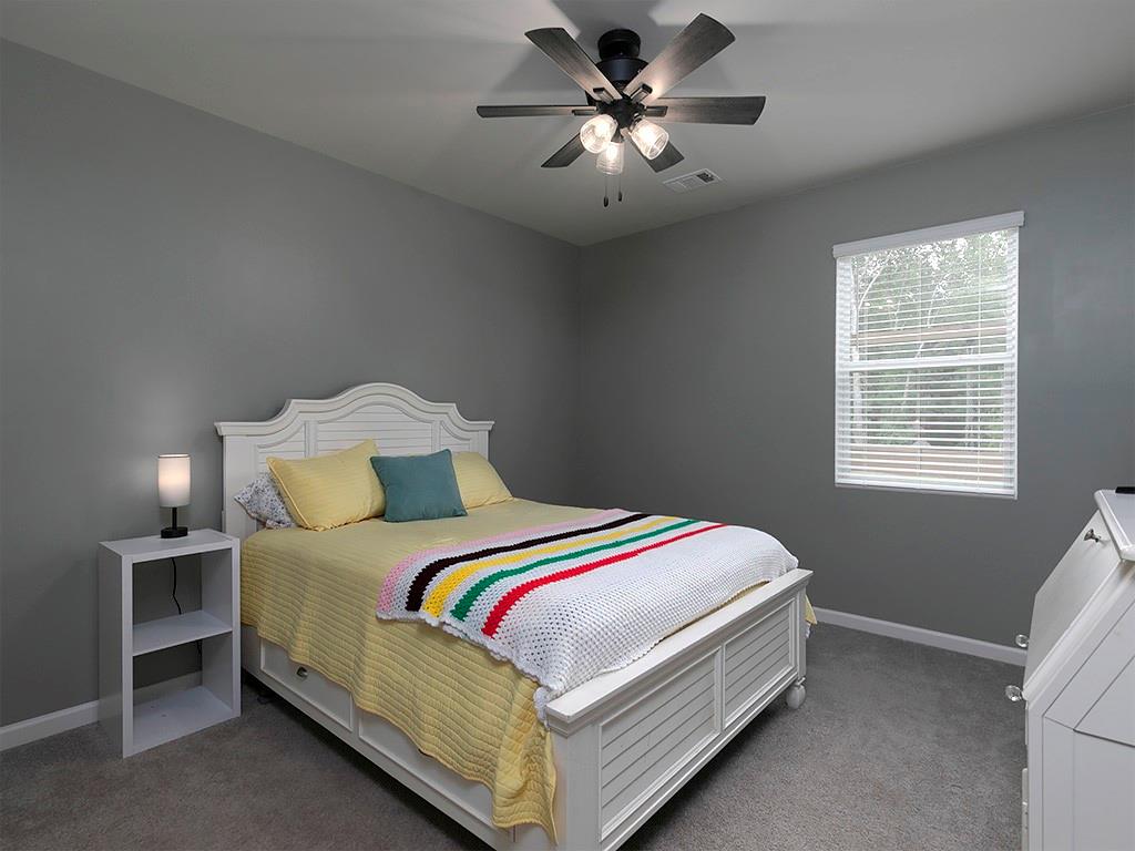 371 Highgrove Circle Dallas, GA 30157 - Photo 10 of 20 a bedroom with a bed and a chandelier