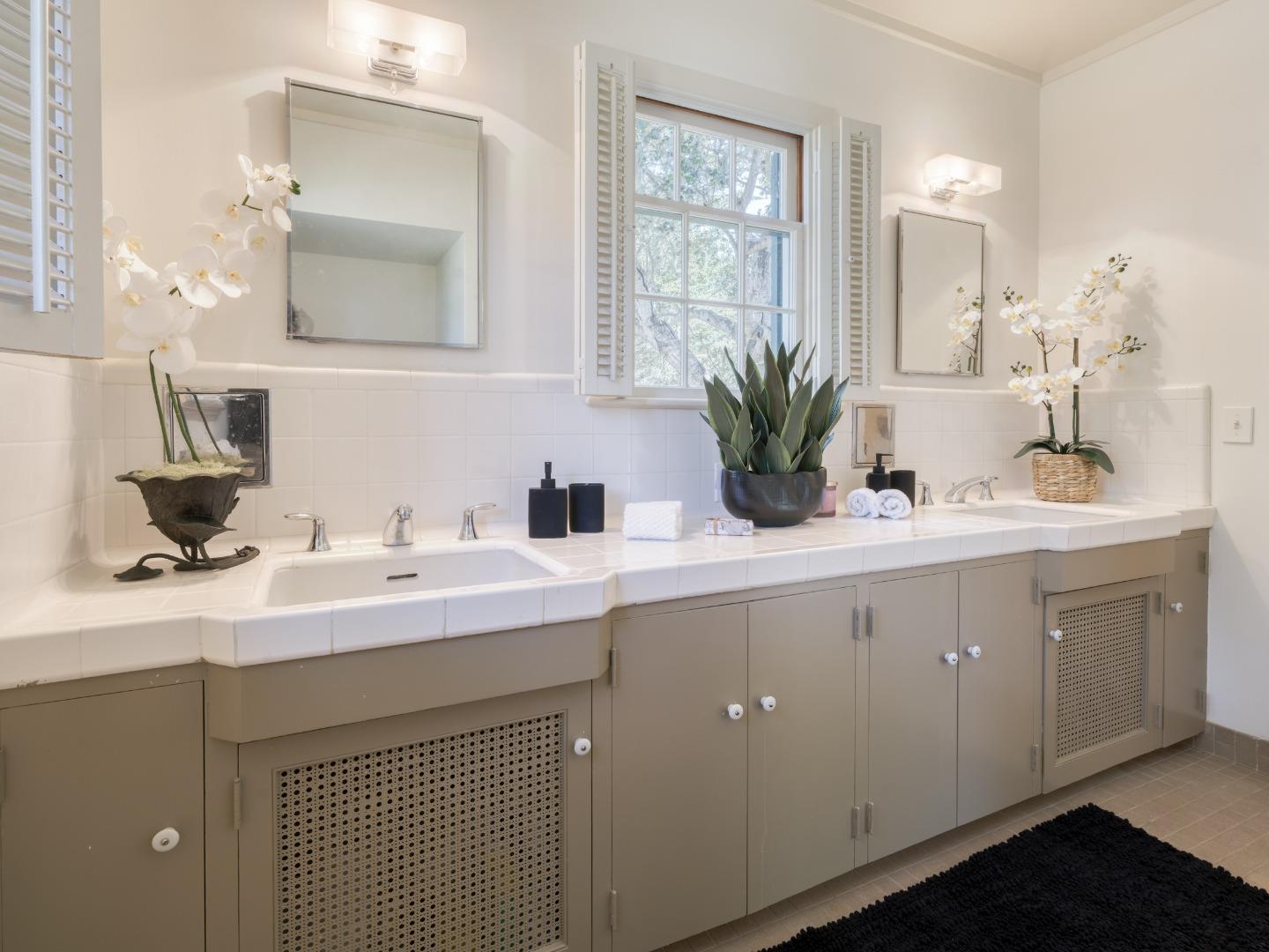 150 Littlefield Road Monterey, CA 93940 - Photo 22 of 51 a bathroom with a sink and a mirror