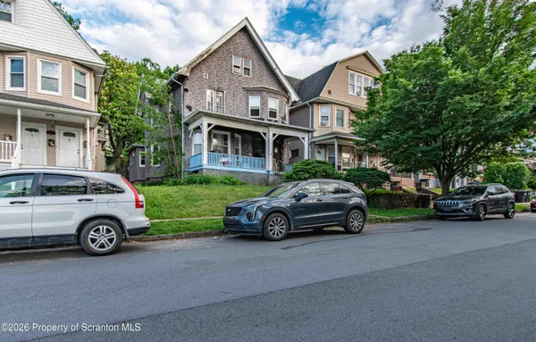a car parked in front of a house