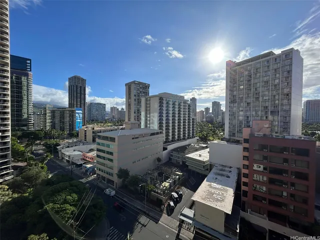 a view of city with tall buildings
