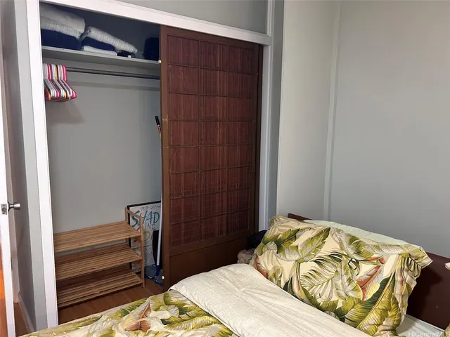 a bedroom with a bed and a dresser