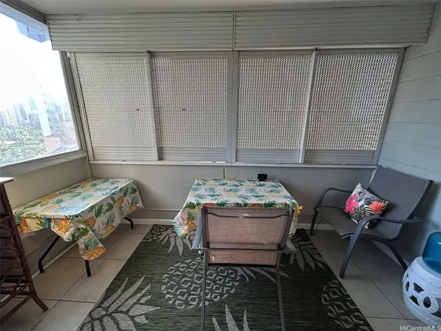 a bedroom with furniture and window