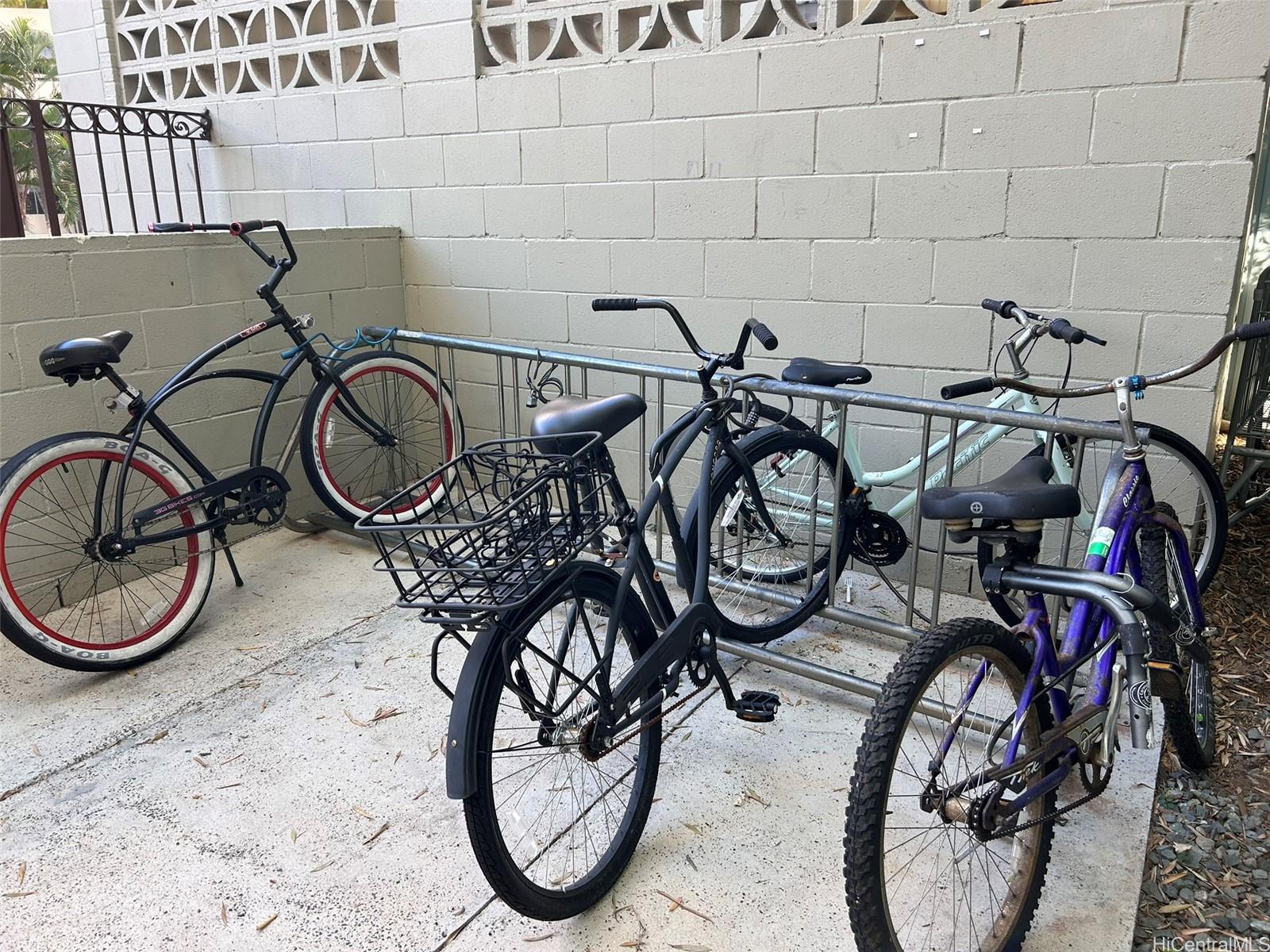 425 Ena Road, Unit 1208A Honolulu, HI 96815 - Photo 19 of 21 a view of a bike garage with cars