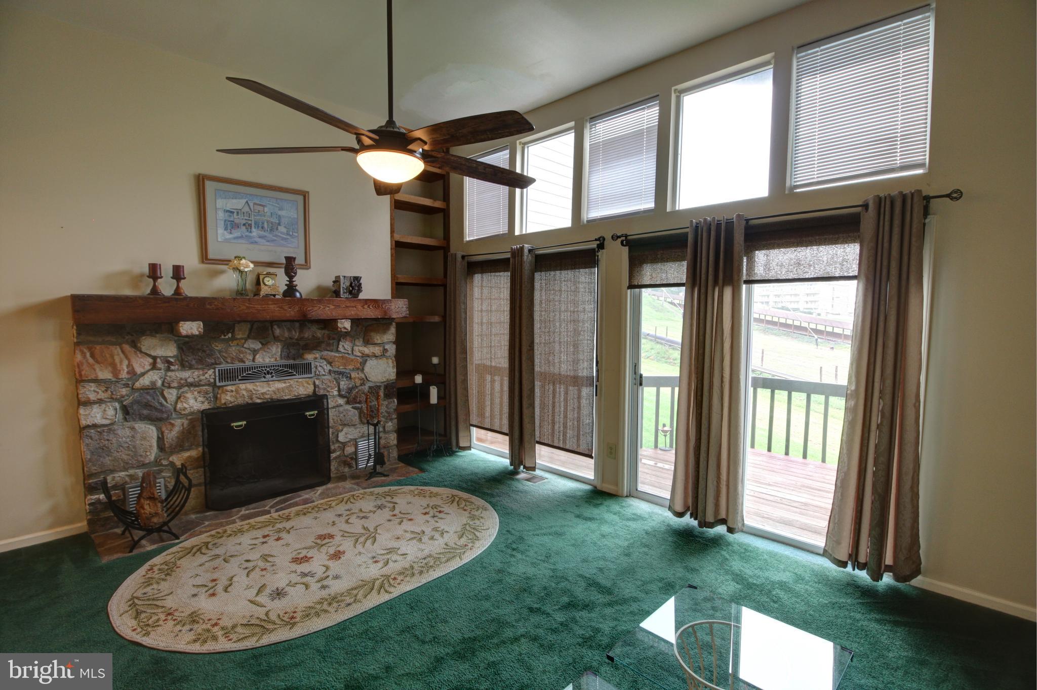 45 Ridge Court, Unit 26 Basye, VA 22842 - Photo 10 of 24 The living room with stone fireplace