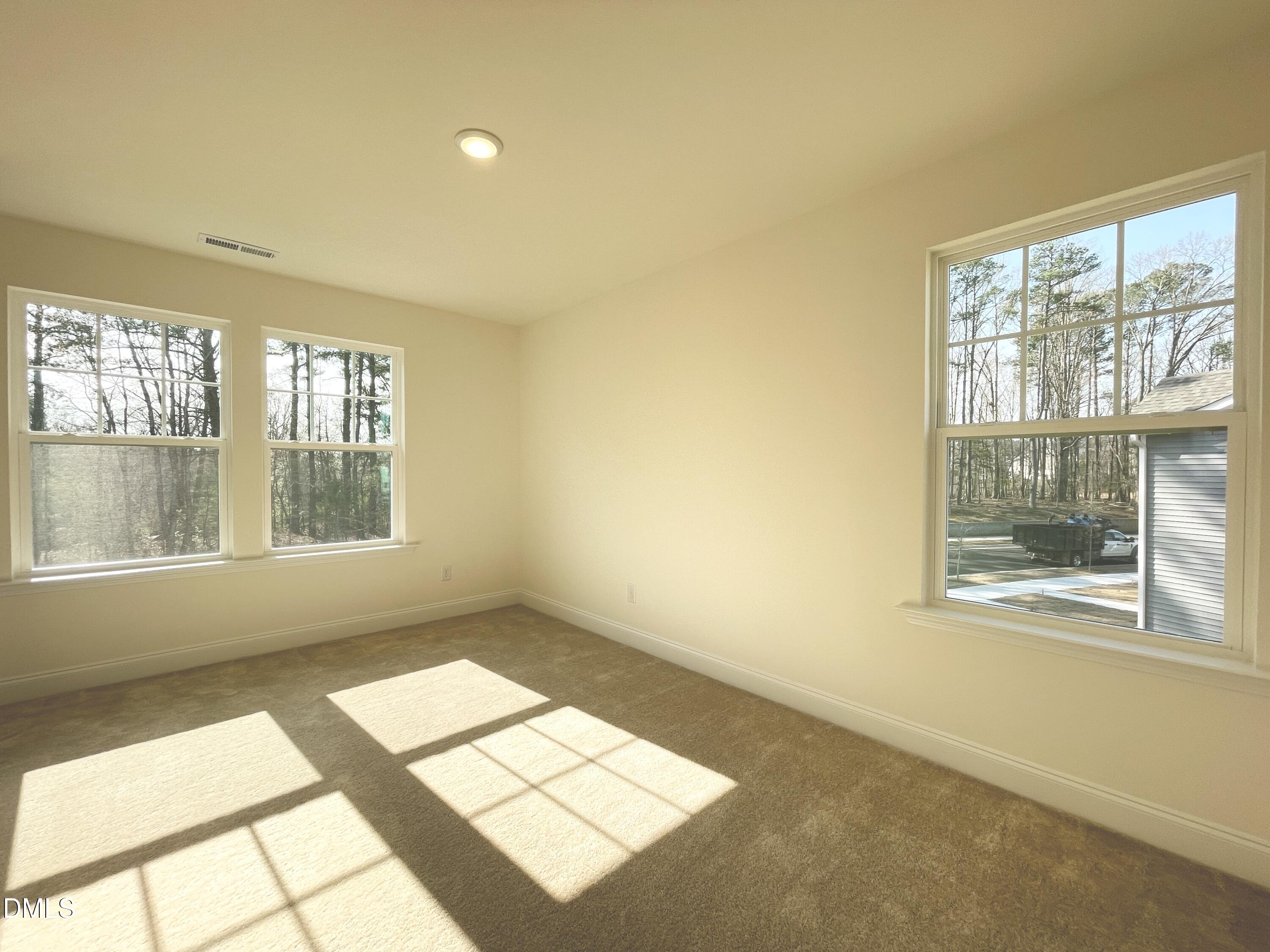 6429 Granite Quarry Drive Raleigh, NC 27610 - Photo 11 of 21 a view of an empty room with a window