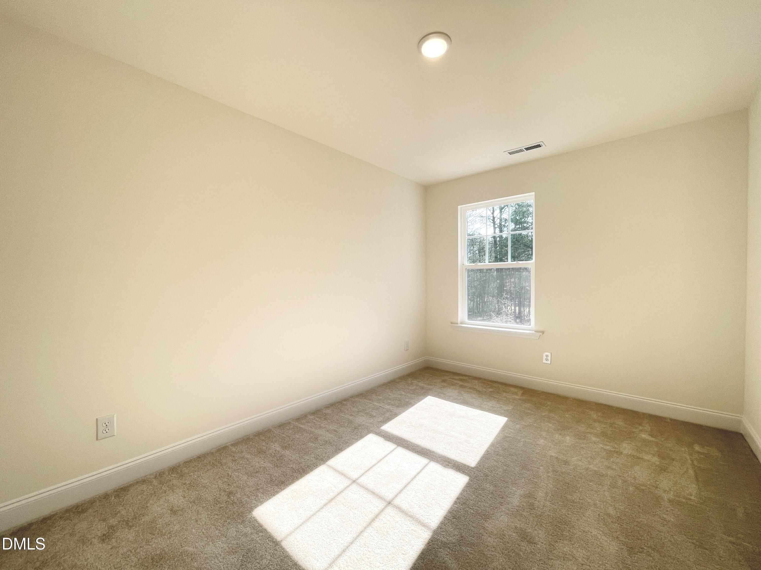 6429 Granite Quarry Drive Raleigh, NC 27610 - Photo 13 of 21 an empty room with windows