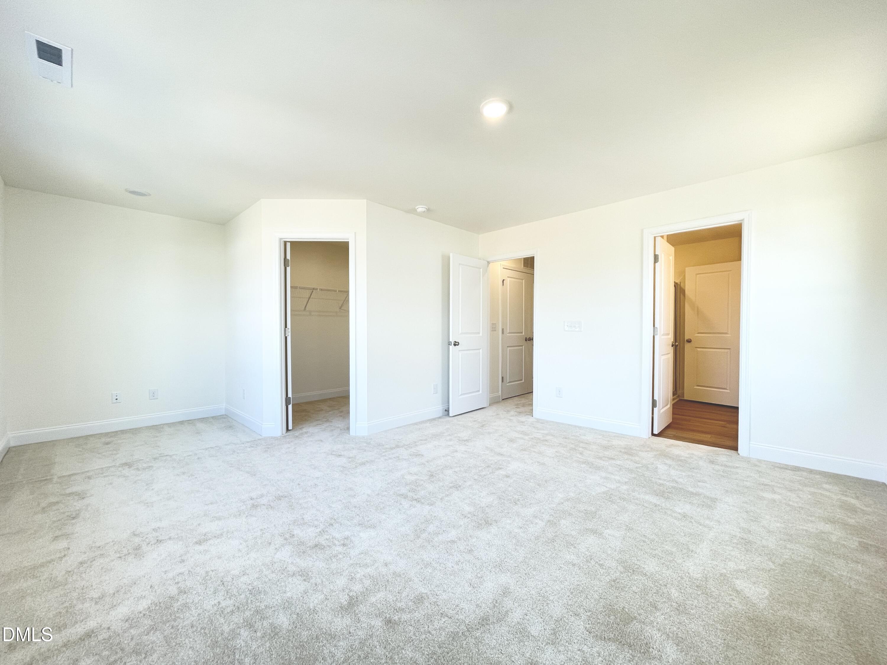 6429 Granite Quarry Drive Raleigh, NC 27610 - Photo 9 of 21 an empty room with an entryway door