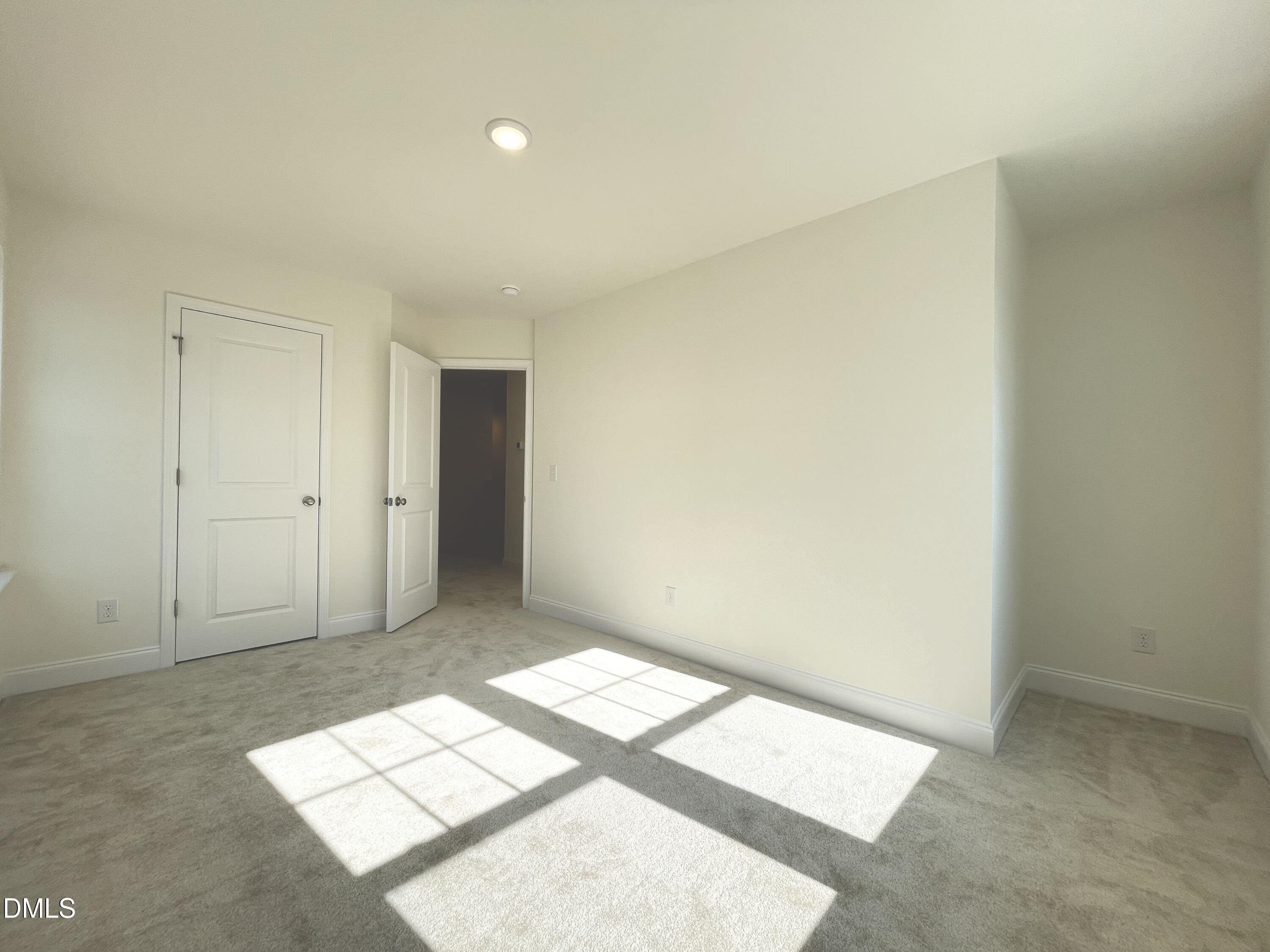 6429 Granite Quarry Drive Raleigh, NC 27610 - Photo 10 of 21 an empty room with windows
