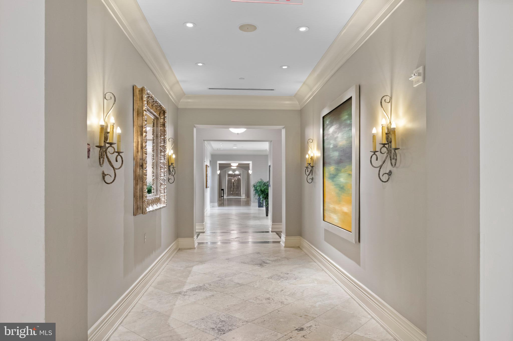 11710 Old Georgetown Road, Unit 1007 North Bethesda, MD 20852 - Photo 7 of 30 a view of a hallway with wooden floor and windows
