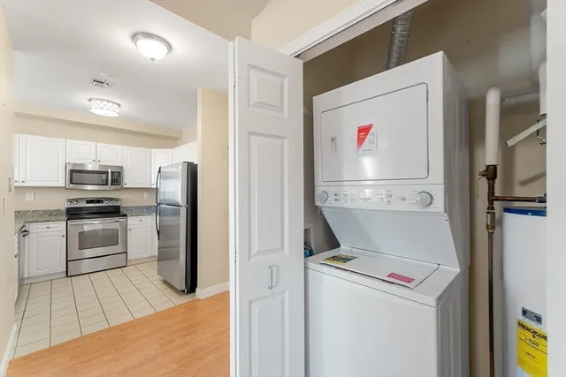 a view of kitchen with cabinets and stainless steel appliances