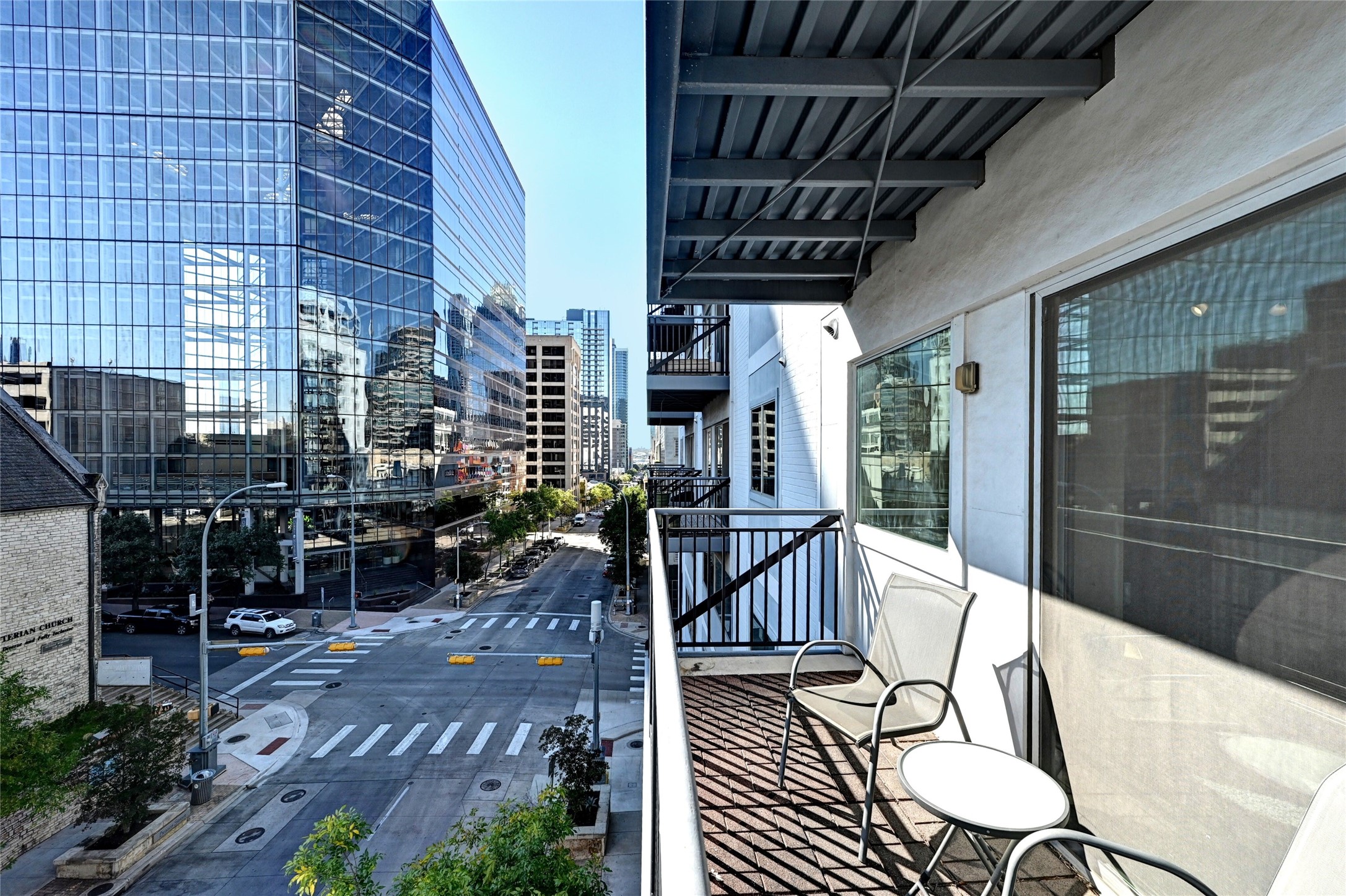 800 Brazos Street, Unit 705 Austin, TX 78701 - Photo 1 of 33 a view of a chairs and table in the patio