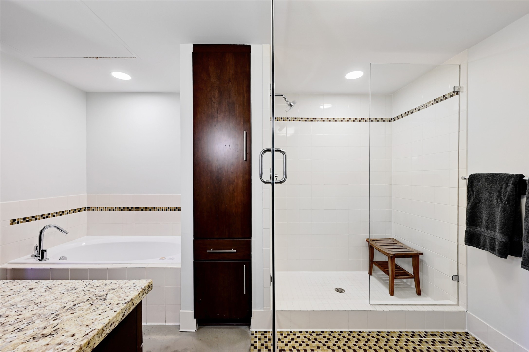 800 Brazos Street, Unit 705 Austin, TX 78701 - Photo 17 of 33 a bathroom with a granite countertop shower sink and mirror