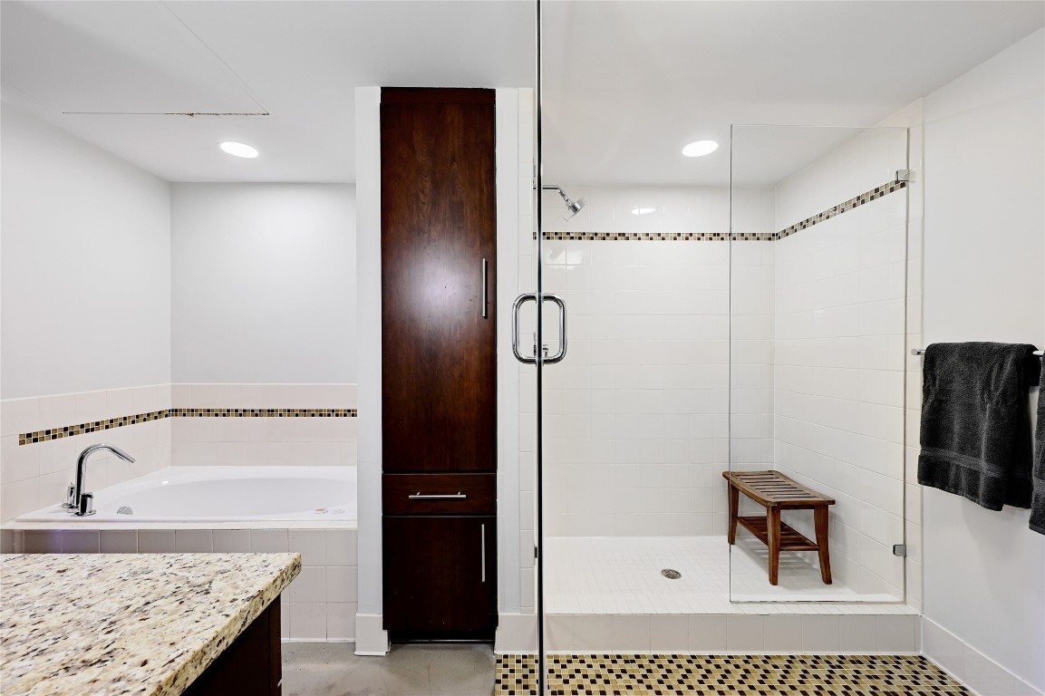 800 Brazos Street, Unit 705 Austin, TX 78701 - Photo 18 of 34 a bathroom with a granite countertop shower sink and mirror