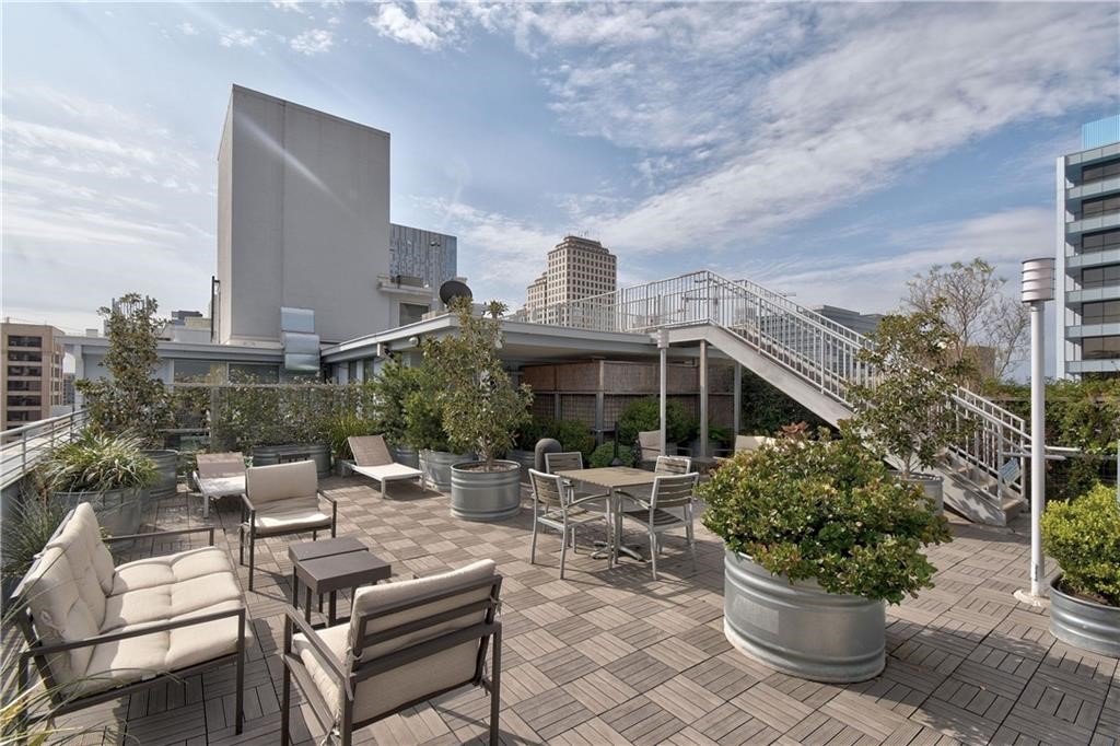 800 Brazos Street, Unit 705 Austin, TX 78701 - Photo 25 of 33 a view of a patio with couches table and chairs and potted plants