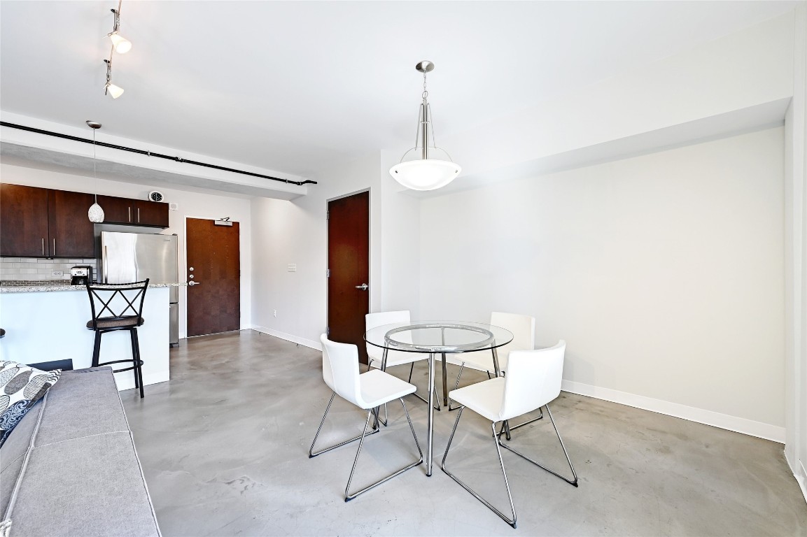 800 Brazos Street, Unit 705 Austin, TX 78701 - Photo 9 of 34 a view of a room with furniture and a chandelier