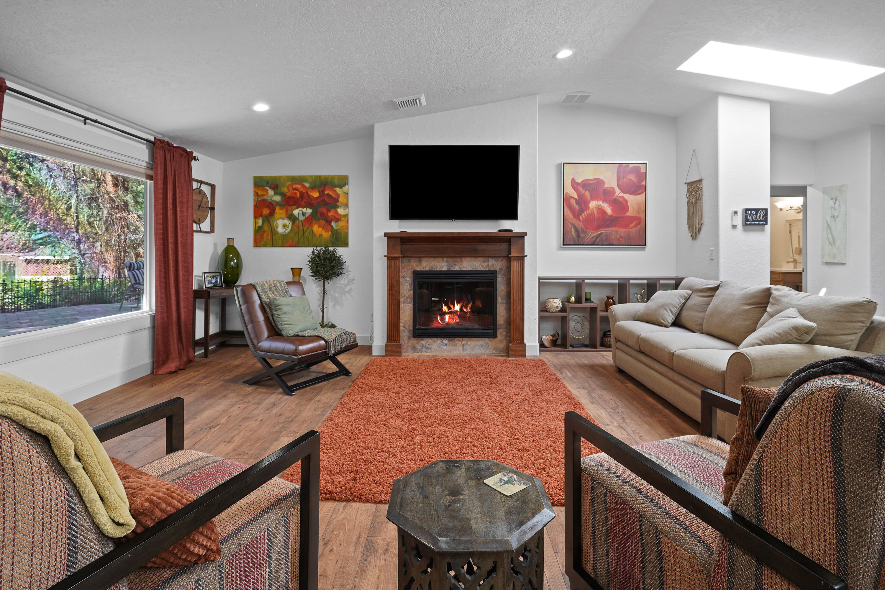 20452 Mainline Road Bend, OR 97702 - Photo 8 of 40 a living room with furniture fireplace and flat screen tv