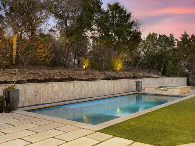 a kitchen with cabinets and white appliances