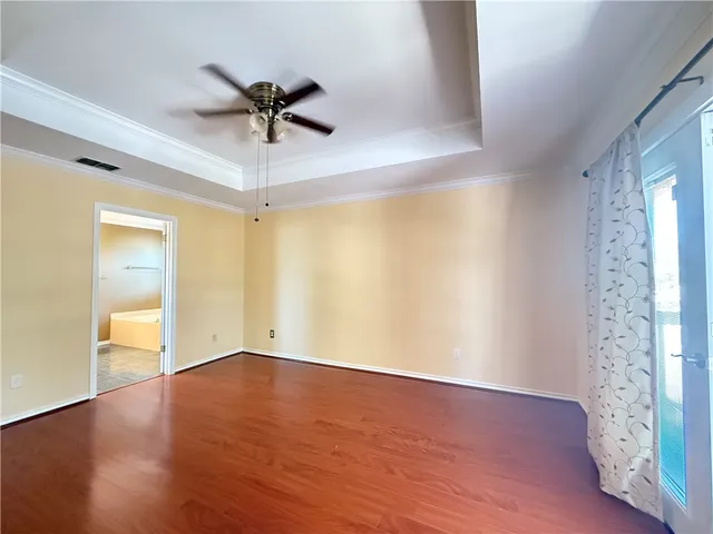 a spacious bathroom with a tub and shower