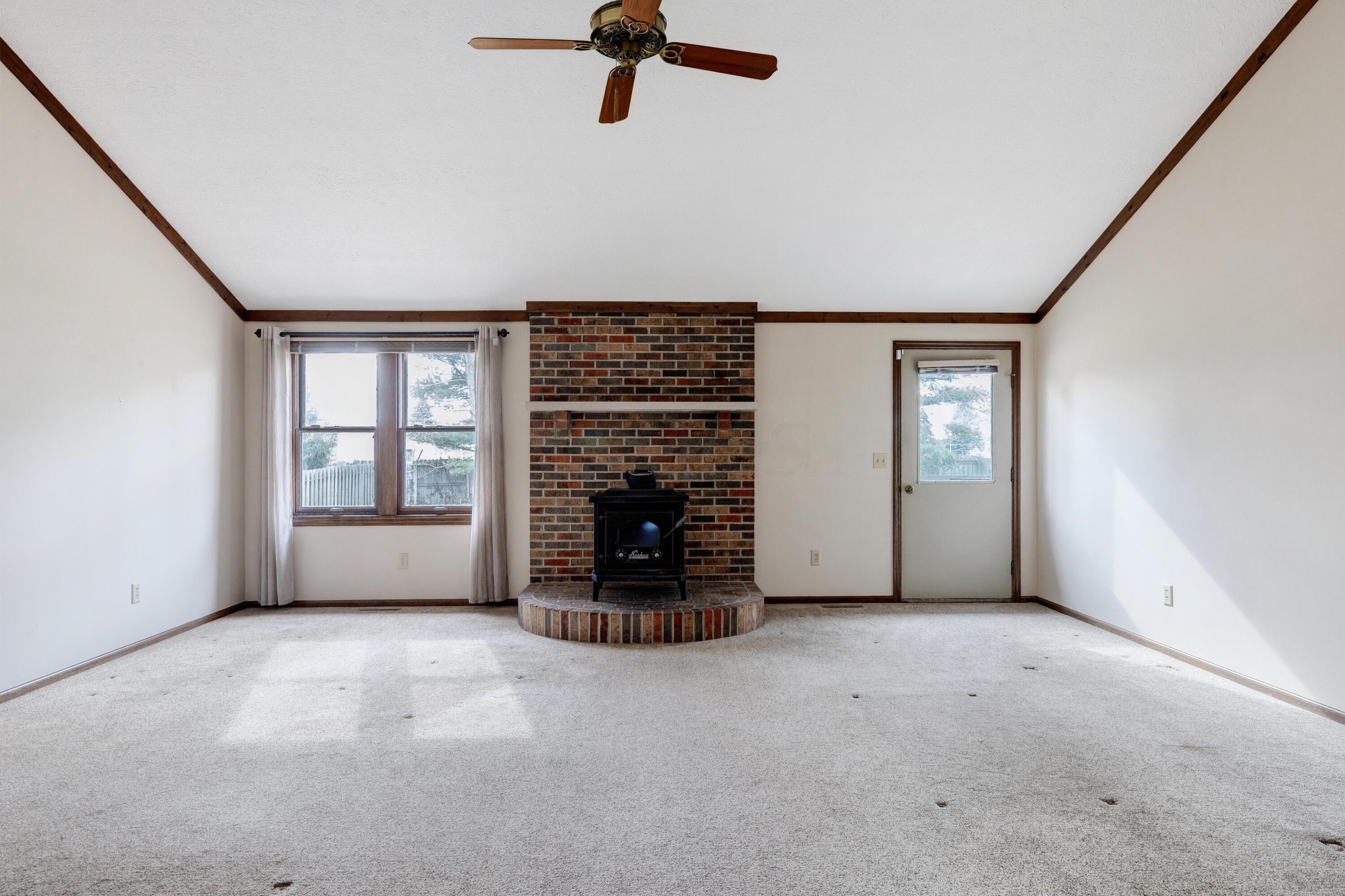 2571 Youngs Grove Road Columbus, OH 43231 - Photo 4 of 40 Great Room with woodburner