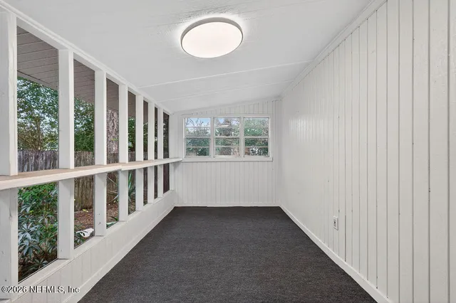 a view of a room with windows