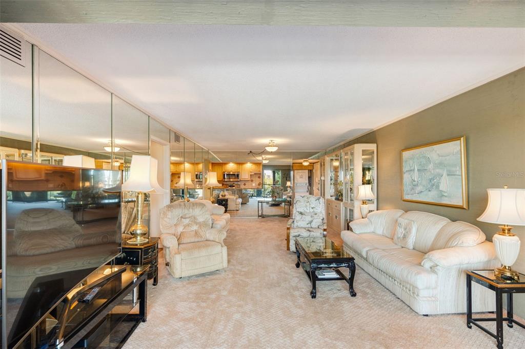 5855 Midnight Pass Road, Unit 318 Sarasota, FL 34242 - Photo 13 of 40 a living room with furniture