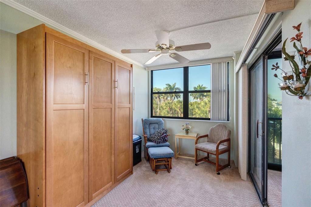 5855 Midnight Pass Road, Unit 318 Sarasota, FL 34242 - Photo 21 of 40 a living room with furniture and a window