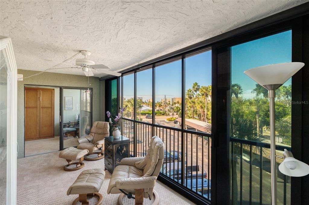 5855 Midnight Pass Road, Unit 318 Sarasota, FL 34242 - Photo 27 of 40 a living room with furniture and a large window