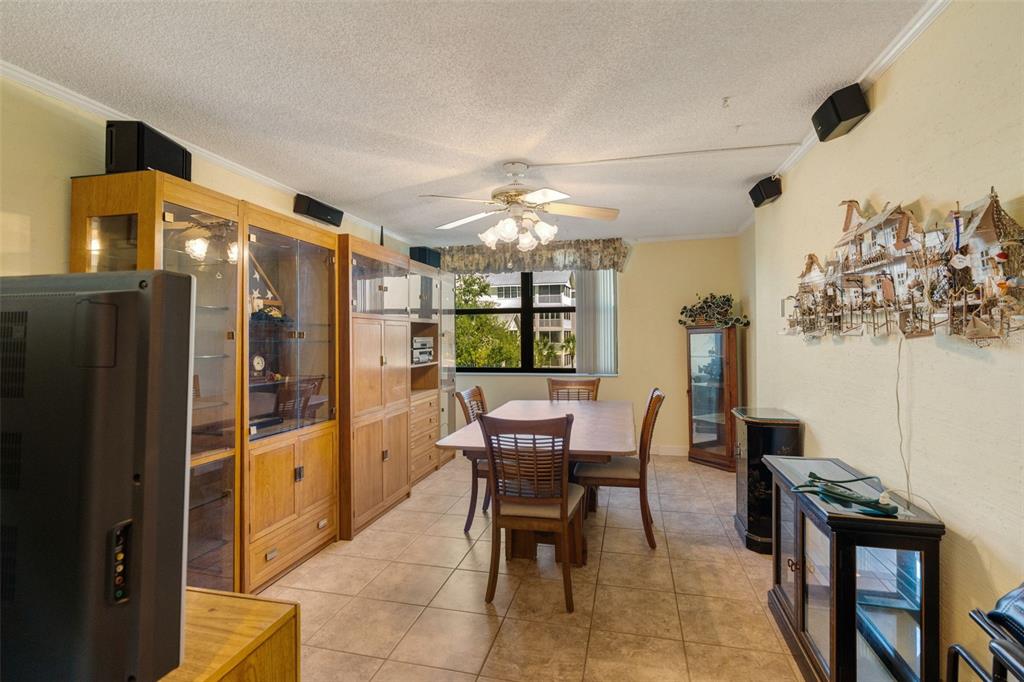 5855 Midnight Pass Road, Unit 318 Sarasota, FL 34242 - Photo 5 of 40 a dining room with furniture and window