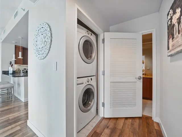 a view of a hallway with washer and dryer