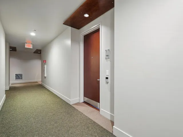 a view of a hallway with closet
