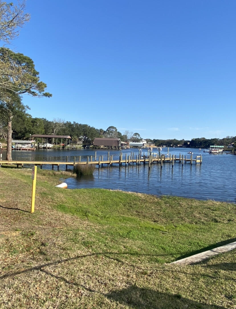 210 Pelham Road, Unit 213A Fort Walton Beach, FL 32547 - Photo 14 of 16 a view of a swimming pool with an ocean view