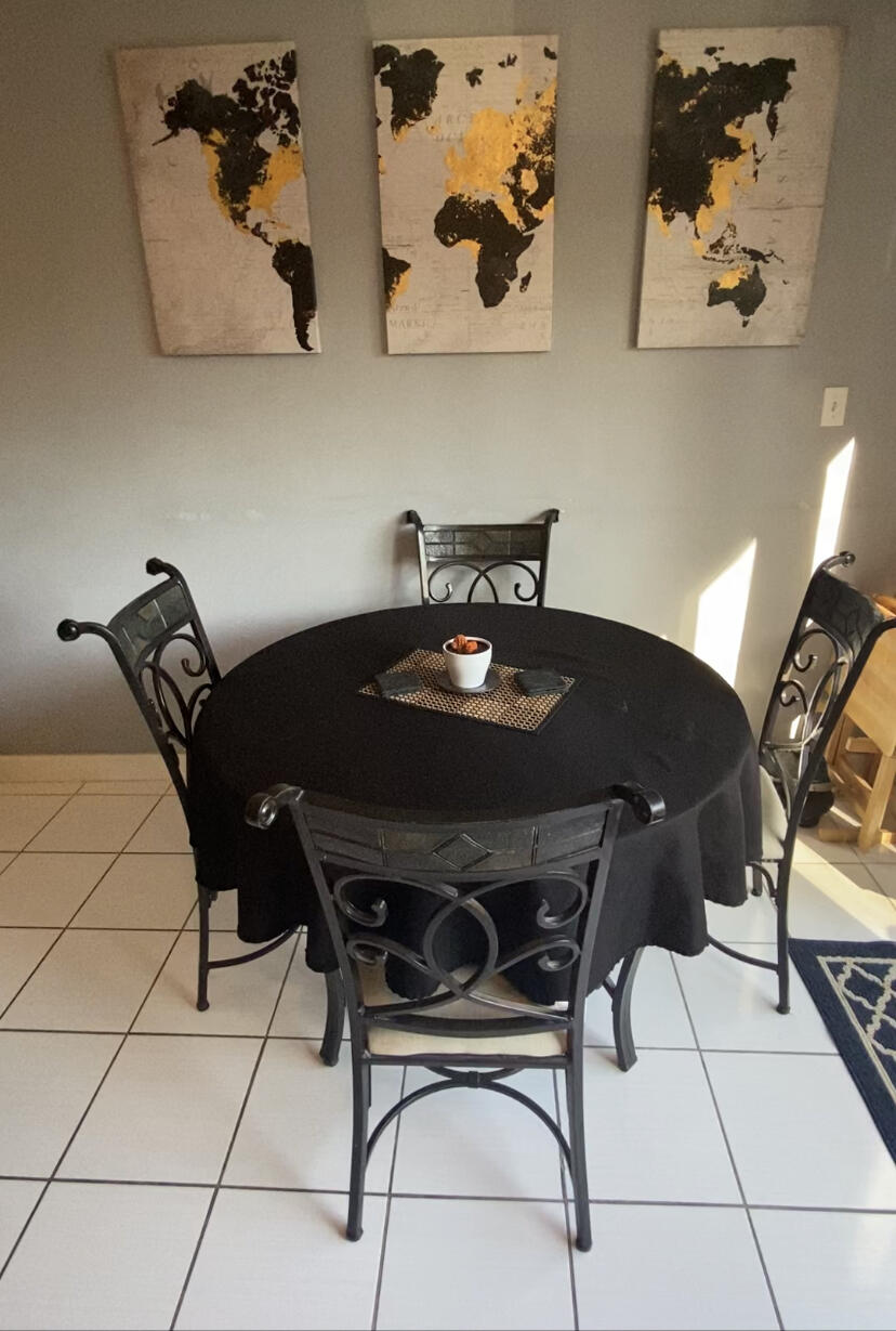 210 Pelham Road, Unit 213A Fort Walton Beach, FL 32547 - Photo 6 of 16 a table and a couch in a room
