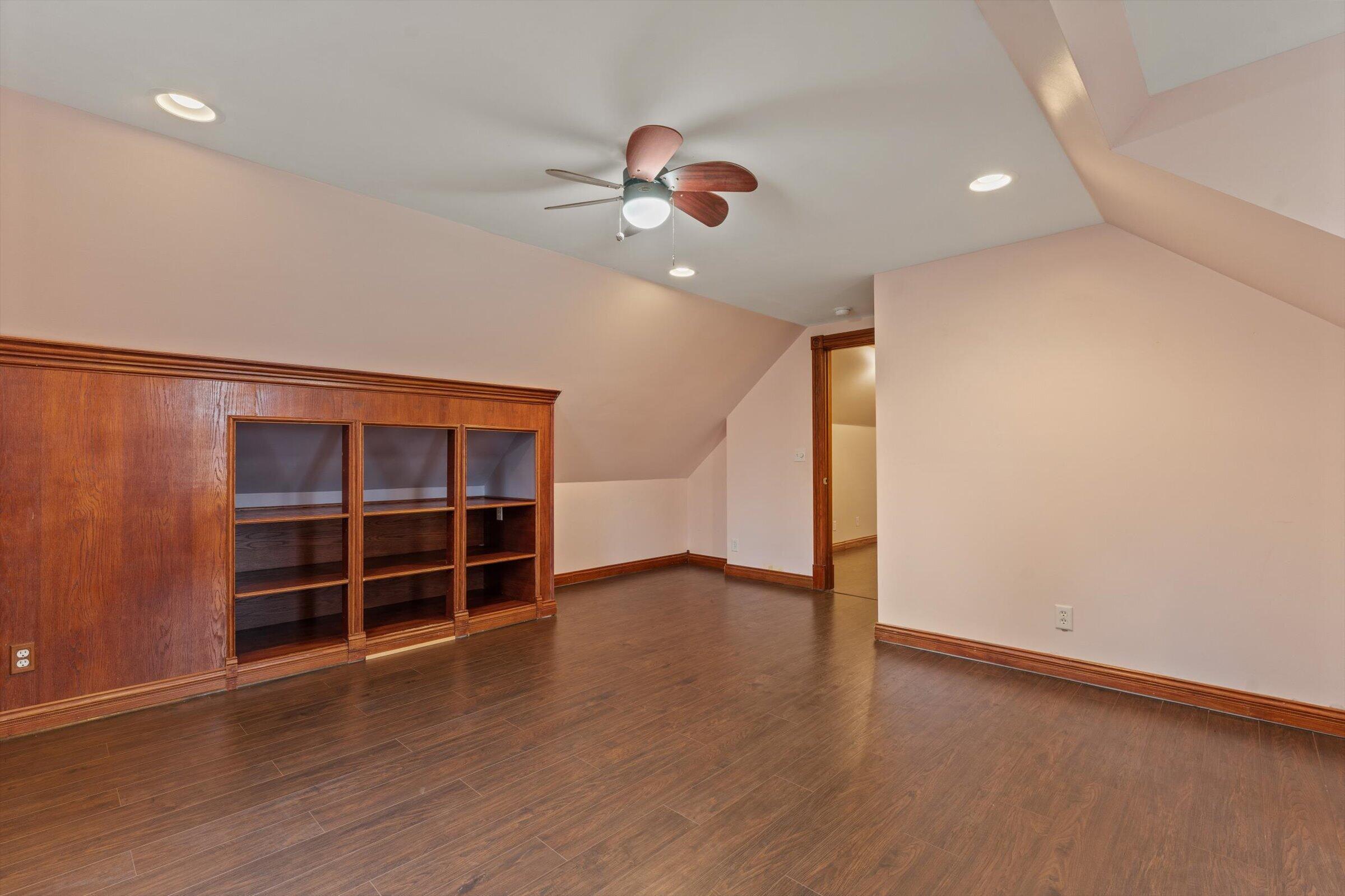 7692 North Emery Road Rolling Prairie, IN 46371 - Photo 44 of 69 wooden floor in an empty room with a window