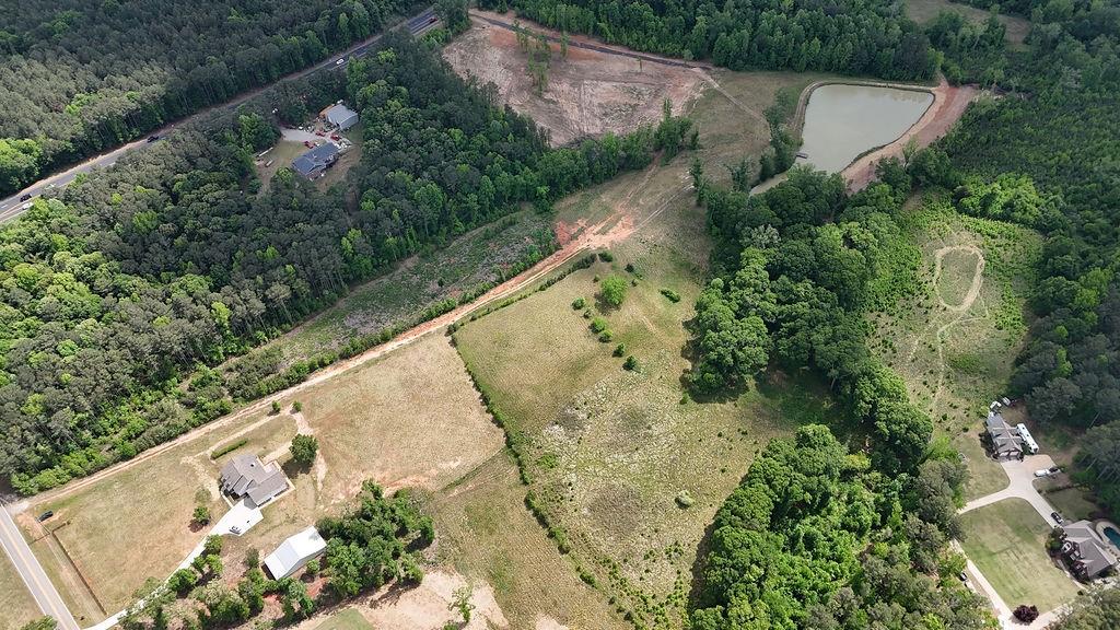 708 Youth Jersey Road Monroe, GA 30655 - Photo 5 of 7 an aerial view of a house with a yard and lake view