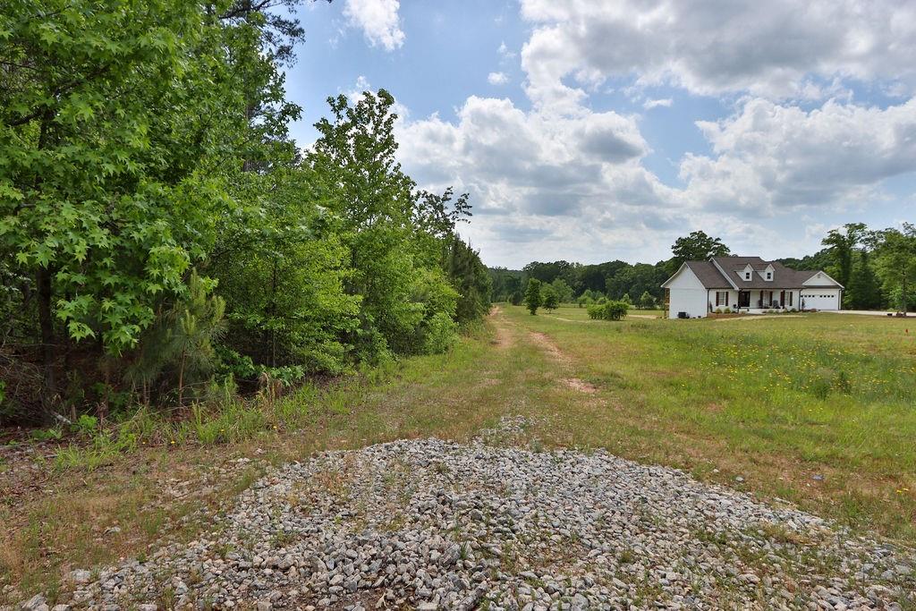 708 Youth Jersey Road Monroe, GA 30655 - Photo 7 of 7 a view of a field with an trees